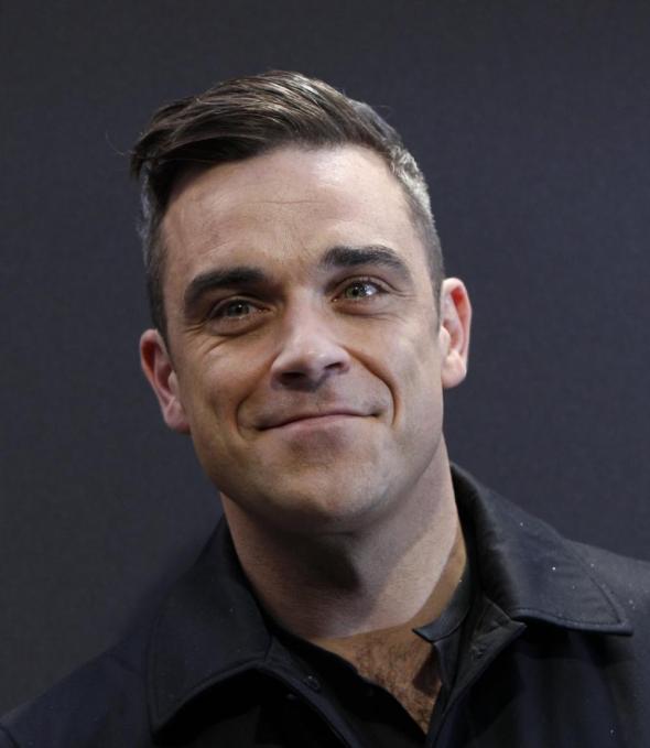 139348-british-singer-robbie-williams-arrives-on-the-red-carpet-for-the-germa